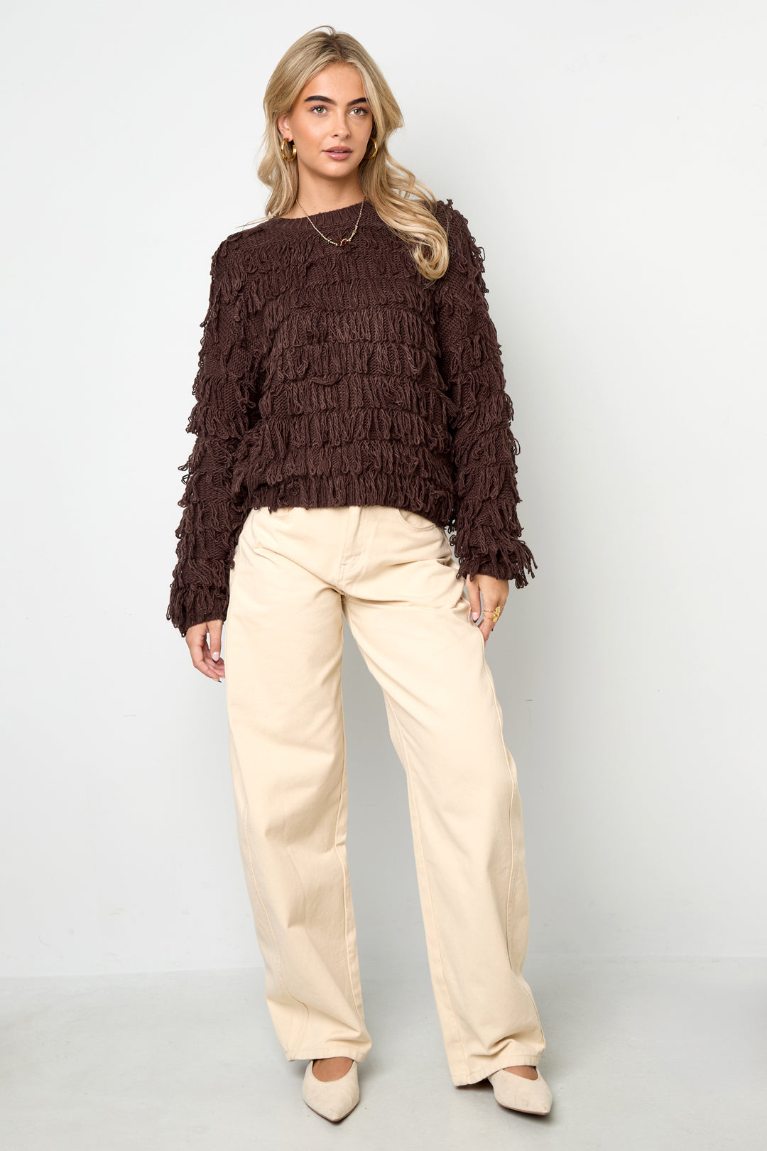 Knitted sweater with fringes