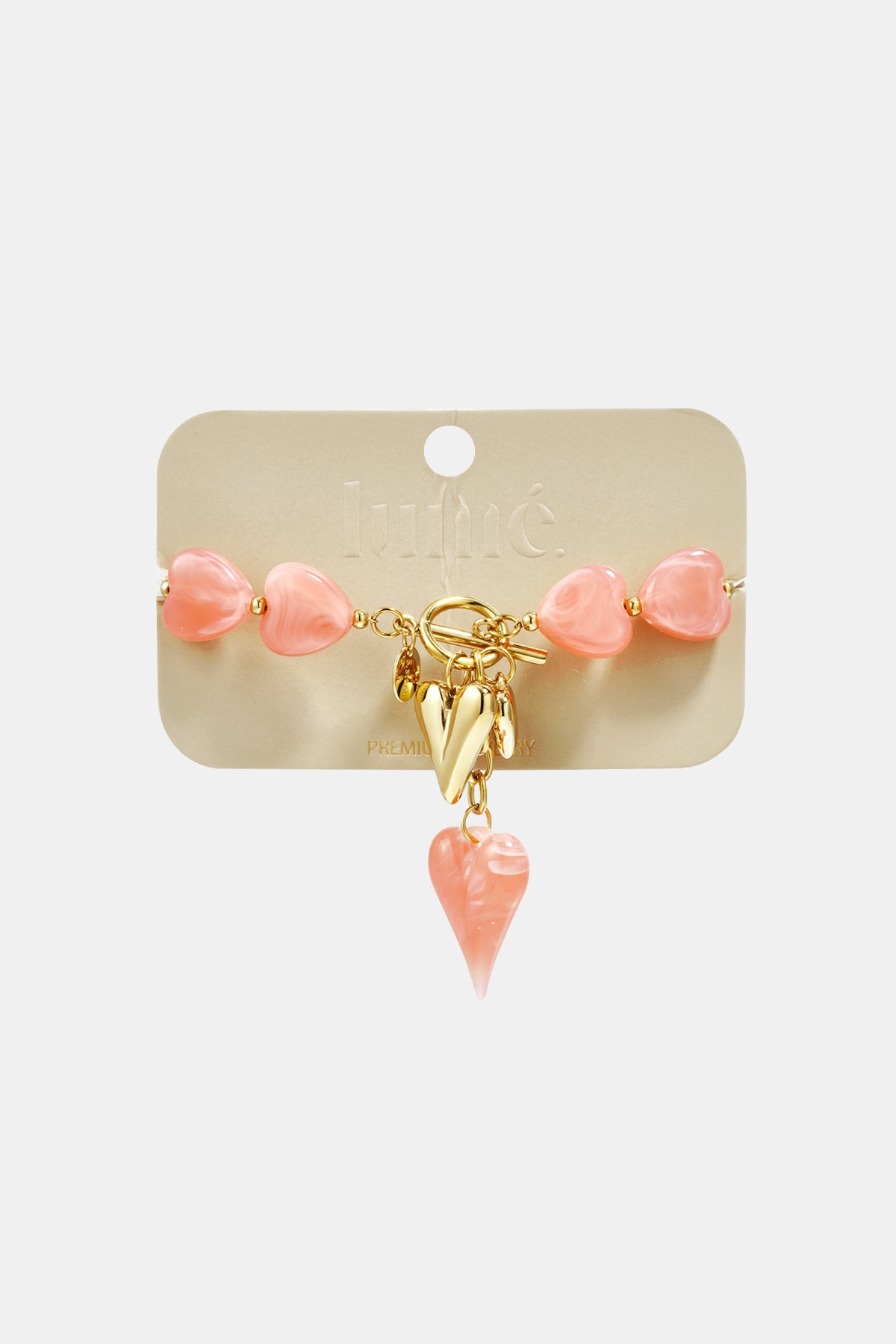 Beaded bracelet with hanging heart charms