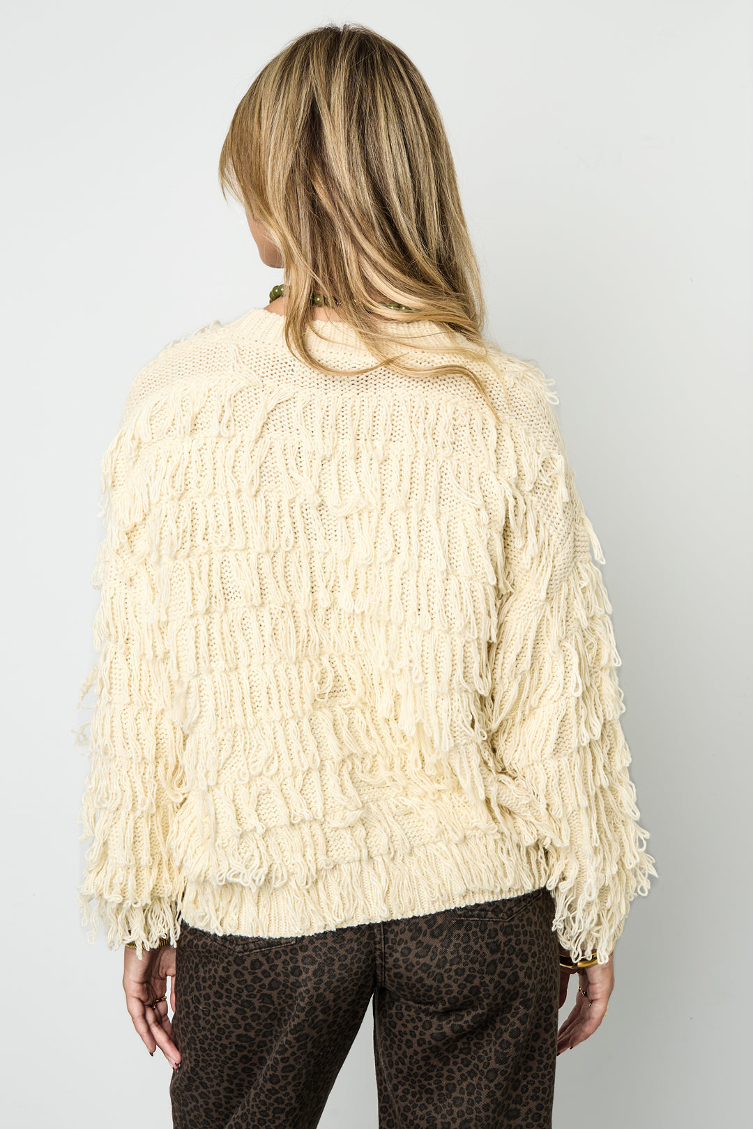 Knitted sweater with fringes
